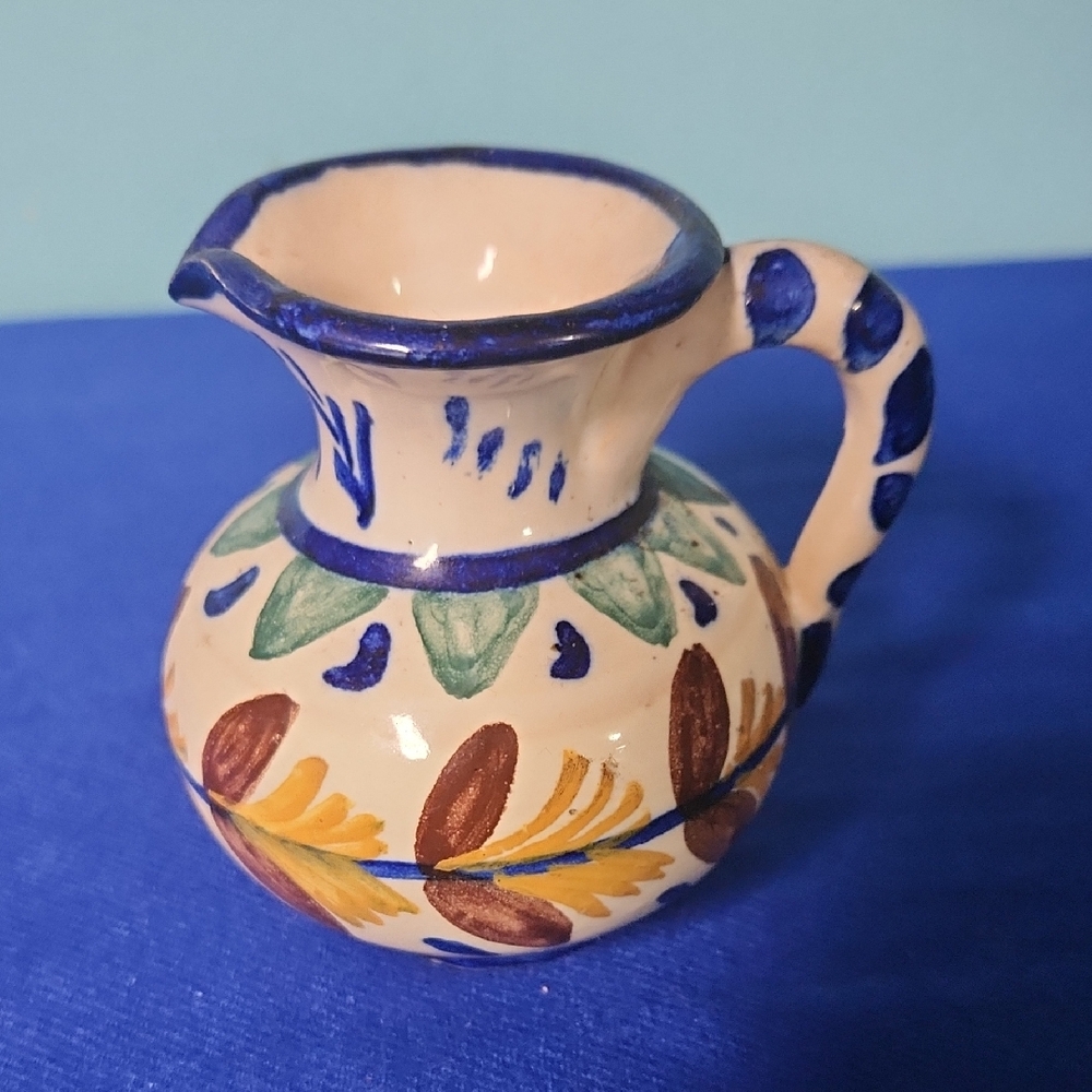 Hand-Painted Ceramic Pitcher with Blue Accents